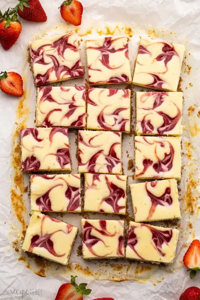 Strawberry Cheesecake Bars by The Recipe Rebel - Creamy, tangy, and fruity dessert!
