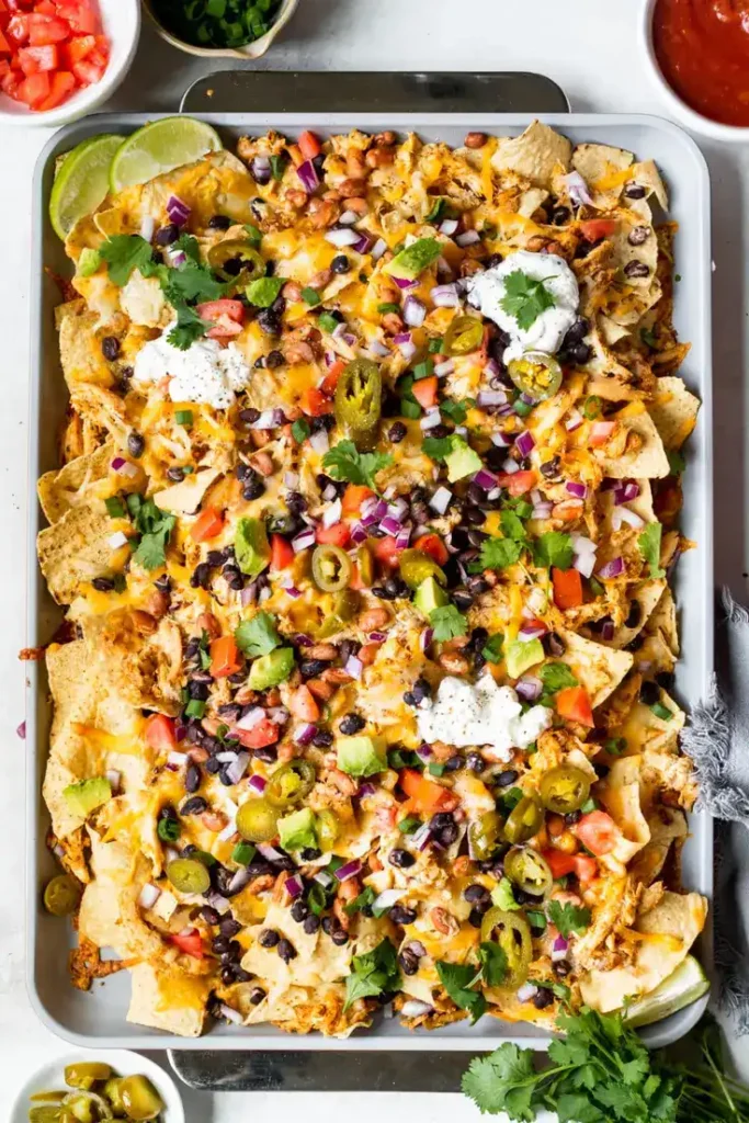 Sheet Pan Chicken Nachos by Krolls Korner - Perfect shareable appetizer for Memorial day! 